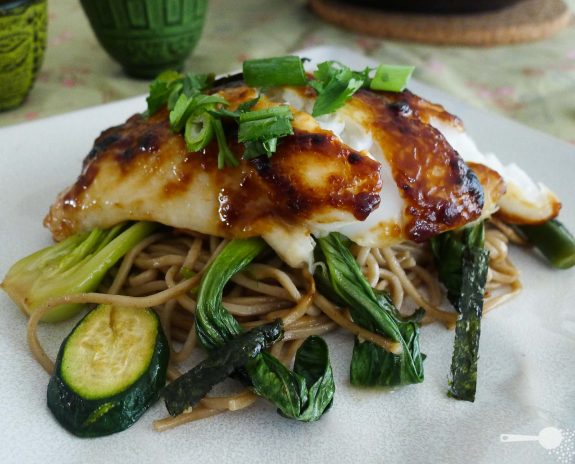 Miso-glazed fish with organic soba noodles and Asian greens